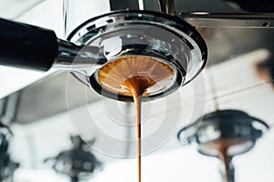 Final stage of the espresso extraction process from bottomless portafilter photo