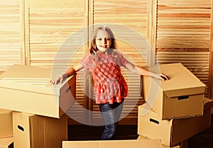 Finally. happy child cardboard box. purchase of new habitation. Cardboard boxes - moving to a new house. repair of room