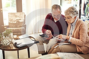 Finance, accounting and budget with an old couple in a home for debt, retirement or pension planning. Insurance, money