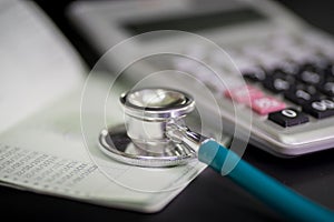 Finance accounting Medical treatment ,Stethoscope and calculator