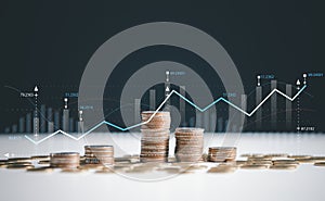 Finance and business concept. Investment graph and rows growth of coins on table, coin money with finance and banking concept for