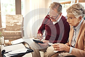 Finance, calculator and budget with an old couple in their home for retirement or pension planning. Debt bills, money or