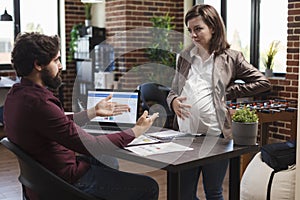 Finance company office workers talking about ineffective startup project ideas.