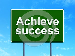 Finance concept: Achieve Success on road sign background