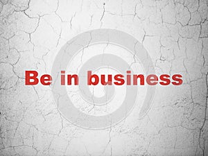 Finance concept: Be in business on wall background