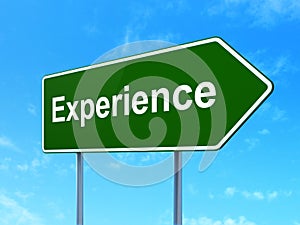 Finance concept: Experience on road sign background