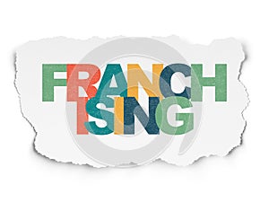 Finance concept: Franchising on Torn Paper