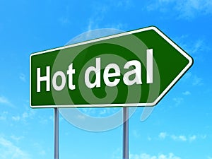 Finance concept: Hot Deal on road sign background