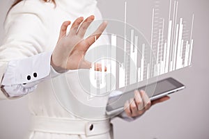 Finance data concept. Woman working with Analytics. Chart graph information on digital screen.