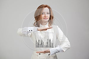 Finance data concept. Woman working with Analytics. Chart graph information on digital screen.