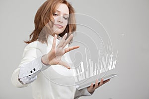 Finance data concept. Woman working with Analytics. Chart graph information on digital screen.