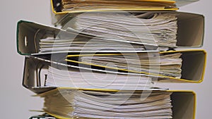 Finance documents in folders. Stacks of files and paperwork in the office