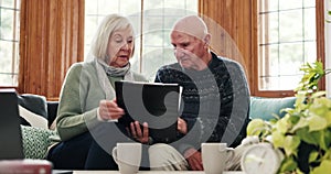 Finance, documents and senior couple on a sofa confused by tax, audit to bankruptcy in their home. Budget, fail and old