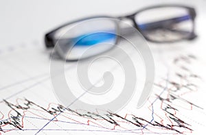 Finance, financial analysis, accounting accounts spreadsheet with glasses