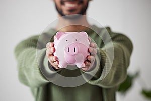 Finance, investment or hands of man with piggy bank for financial wealth growth or savings increase. Closeup, income or