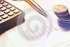 Finance saving concept, calculator with cion on paperwork report