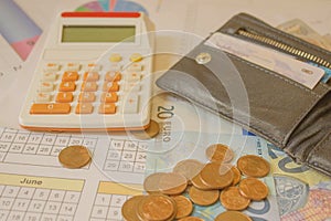 Finance, saving money or investment concept : Coin stacks, pen and savings account passbook or financial statement on office desk