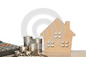 Finance, Stack of coins money and Model house on white background, Business investment and real estate