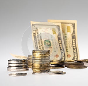 Finance. stacks of coins and paper bills on a gray background