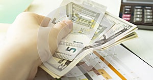 finances concept - close up of womans cupped hands showing euro coins