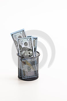 Finances and Savings Concepts. Stack of Money Banknotes in US Dollar Currency Placed in in Basket Against White Background