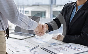 Financial accountants and marketers shaking hand to congratulate the double-digit real estate performance