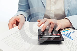 Financial accounting business woman using calculator