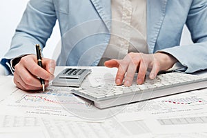 Financial accounting business woman using computer keyboard