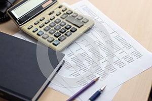 Financial accounting report with book and calculator