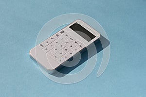 Financial activity, accounting, tax calculation or saving and investment. calculator on solid blue background