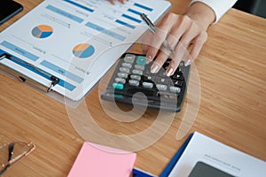 Financial adviser use calculator to calculate revenue & budget. accountant doing accounting. bookkeeper making calculation