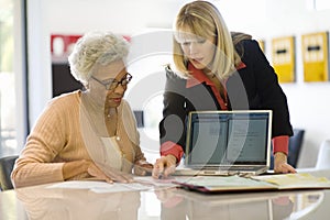 Financial Advisor Assisting Senior Woman photo