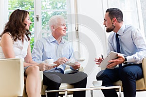 Financial advisor consulting couple in retirement planning