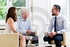 Financial advisor consulting couple in retirement planning
