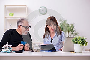 Financial advisor giving retirement advice to old man