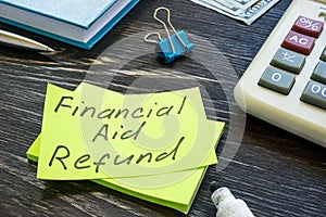 Financial aid refund handwritten on sticker and marker.