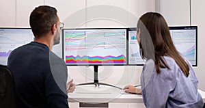 Financial Analyst Examining Sankey Chart Dashboard On Computer Screen