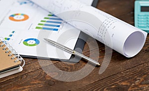 financial and business color charts and graphs on the table.