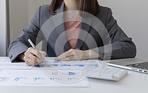 Financial businesswomen analyze the graph of the company`s performance to create profits and growth