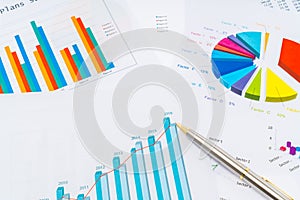 Financial charts with pen .