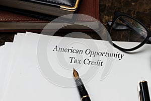 Financial concept about American Opportunity Tax Credit AOTC with phrase on the page