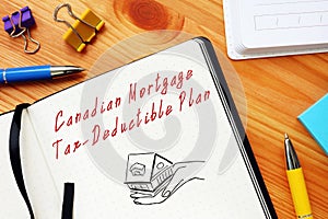 Financial concept about Canadian Mortgage Tax-Deductible Plan with sign on the page