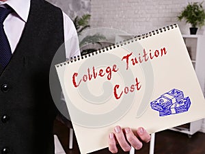 Financial concept about College Tuition Cost with inscription on the sheet