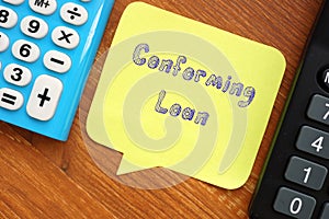 Financial concept about Conforming Loan with inscription on the page photo