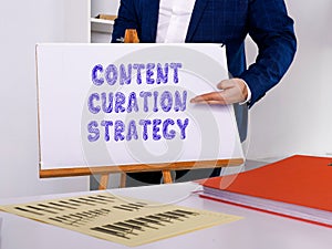 Financial concept about CONTENT CURATION STRATEGY with sign on the sheet photo