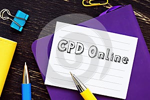 Financial concept about CPD Online Continuing Professional Development with inscription on the sheet photo