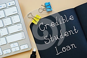 Financial concept about Credible Student Loan with inscription on the sheet