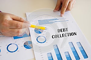 Financial concept about DEBT COLLECTION with sign on the financial document