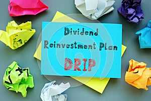Financial concept about Dividend Reinvestment Plan DRIP with sign on the page