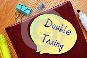 Financial concept about Double Taxing with phrase on the page